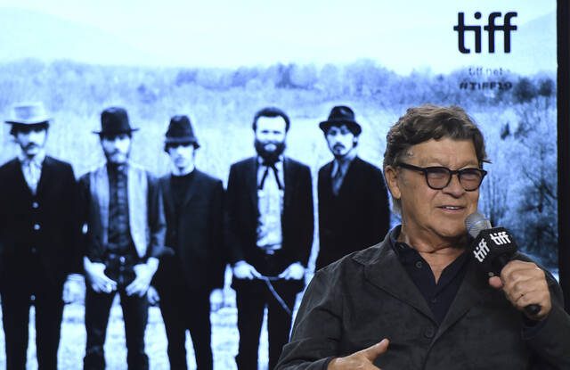 Robbie Robertson, lead guitarist and songwriter of The Band, dies at 80