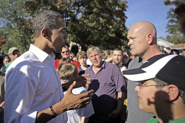 Democratic presidential candidate, U.S. Sen. Barack Obama, D-Ill., left, answers a question from Joe Wurzelbacher, also known as ‘Joe the Plumber,’ right, in Holland, Ohio.