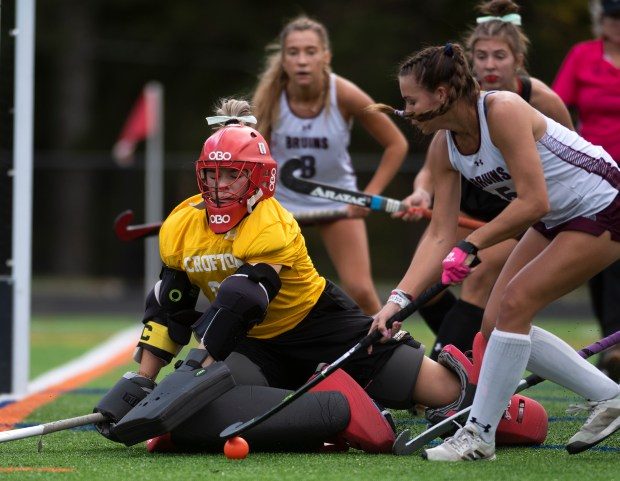 Crofton goalkeeper Ryleigh Osborne defends the goal against Broadneck's Faith Everett during field hockey in the Anne Arundel County Championships at Annapolis High School Saturday, Oct. 21, 2023. Broadneck won 3-2.