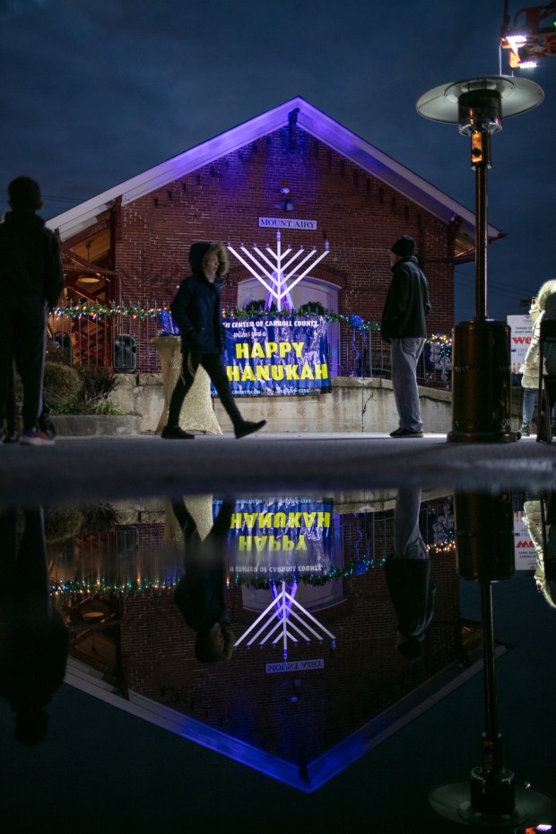 Dec. 7, 2023: People gather at the Mt. Airy Train Station rail yard to celebrate the first night and lighting of the first menorah candle for Chanukah.The annual Chanukah Menorah lighting on Main Street in Mt. Airy, co-hosted by the Chabad Jewish Center of Carroll County. (Nate Pesce/ for Carroll County Times)