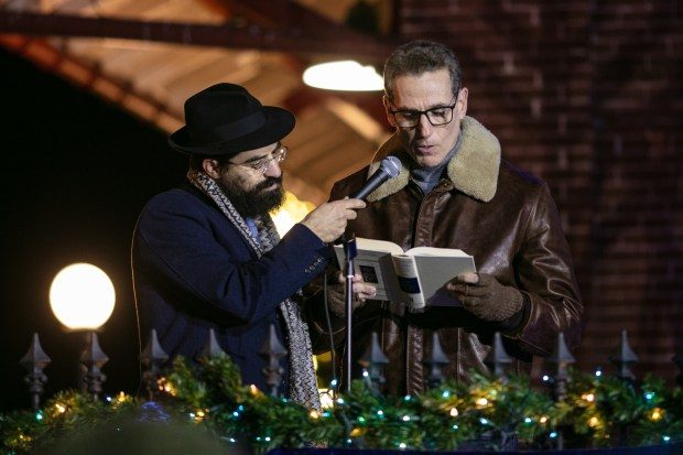 Dec. 7, 2023: Rabbi Sholly Cohen, left, and Boaz Schwartz, of Mt. Airy, lead a prayer for the Israel-Gaza conflict.The annual Chanukah Menorah lighting on Main Street in Mt. Airy, co-hosted by the Chabad Jewish Center of Carroll County. (Nate Pesce/ for Carroll County Times)