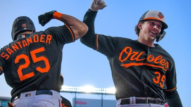 Baltimore Orioles designated hitter Adley Rutschman (35) celebrates his home run against the Houston Astros with Anthony Santander (25) during major league baseball at Oriole Park at Camden Yards.