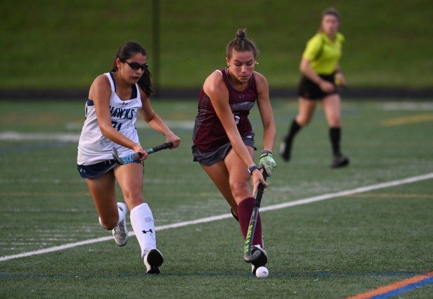 Broadneck's Faith Everett sprints up the field with the ball as River Hill's Sophie Chudnovsky defends on the play during a field hockey game at River Hill High School on Wednesday, September 13, 2023.
