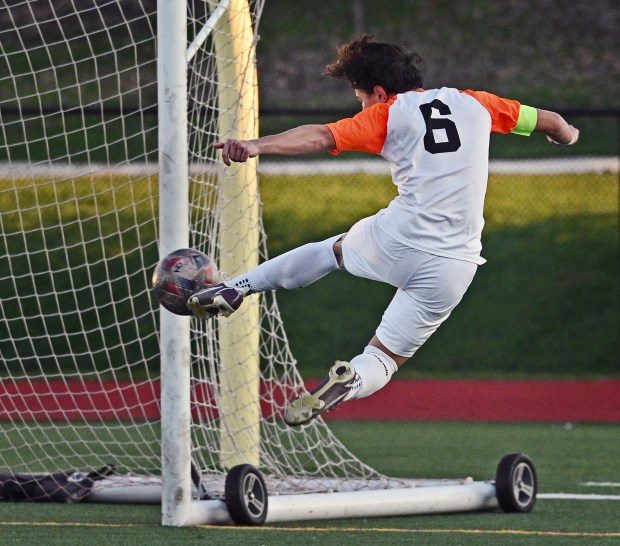 McDonogh's Kobe Keomany takes a shot in overtime that was caught by Archbishop Curley goalie Joe Yakim.
