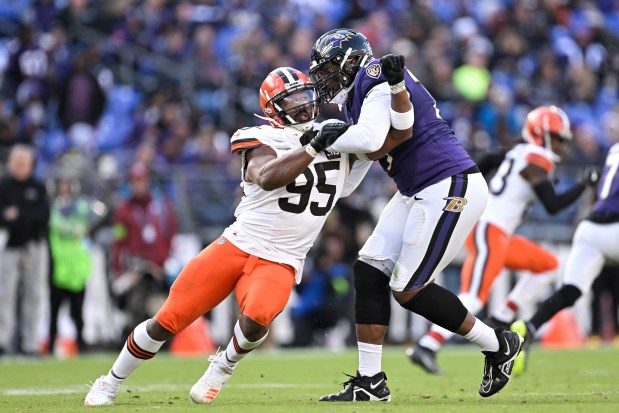 Browns defensive end Myles Garrett, left, rushes the passer while being blocked by Ravens left tackle Ronnie Stanley on Nov. 12.