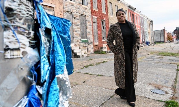 Dec. 5, 2023: Ebony McClenny started a nonprofit called Surviving Our Neighborhoods (S.O.N.) after her 17-year-old son, Dakarai Baldwin, was fatally wounded in a triple shooting last year. She visits the 1900 block of North Collington Avenue where the shooting occurred. (Kim Hairston/Staff photo)