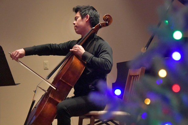 Dec. 10, 2023: Cellist Alex Wu, a graduate student at Peabody Institute, performs in concert at Roland Park Place. Wu is the musician-in-residence at Roland Park Place for the academic year. Wu performs weekly at the retirement community weekly and interacts with residents. Wu also brings in other guest artists for concerts, such as fellow Peabody student, pianist Jiacheng Li, who performed at this concert. (Amy Davis/Staff photo)