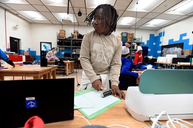 DEC. 5, 2023: Zaire Blackwell, 12, works on project at Digital Harbor Foundation Tech Center's programs for youth and educators on the use of digital tools. (Kenneth K. Lam/Staff photo)