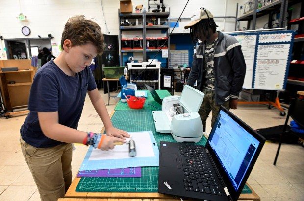 DEC. 5, 2023: Albie Funk, 9, works on project at Digital Harbor Foundation Tech Center's programs for youth and educators on the use of digital tools. (Kenneth K. Lam/Staff photo)
