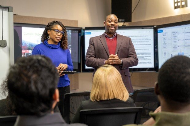 At Morgan State University's Center for Equitable Artificial Intelligence and Machine Learning Systems, Gabriella Waters, director of operations and research, and Kofi Nyarko, director, present. (P.A. Greene/Handout photo)