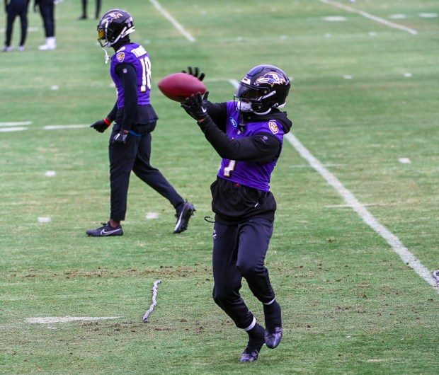 Ravens wide receiver Rashod Bateman catches a pass during practice. (Kevin Richardson/Staff)