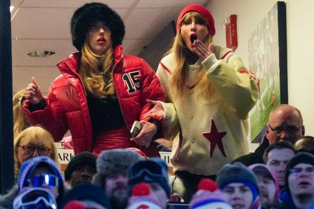 Taylor Swift, right, and Brittany Mahomes react during the third quarter Sunday in Orchard Park, New York, during the Chiefs' playoff victory against the Bills. (Frank Franklin II/AP)