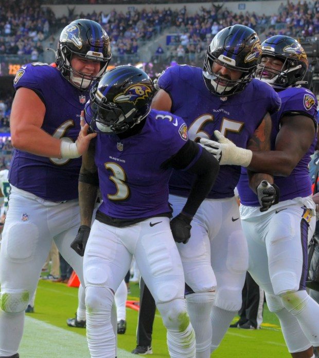 Baltimore Ravens wide receiver Odell Beckham Jr. (3) celebrates his first Baltimore touchdown with center Tyler Linderbaum, (left), offensive lineman Patrick Mekari (65) and guard John Simpson (right) during the fourth quarter of a battle between NFL division leaders in Baltimore Sunday Nov. 5, 2023. Baltimore routed the Seahawks, 37-3.(Karl Merton Ferron/Baltimore Sun Staff)