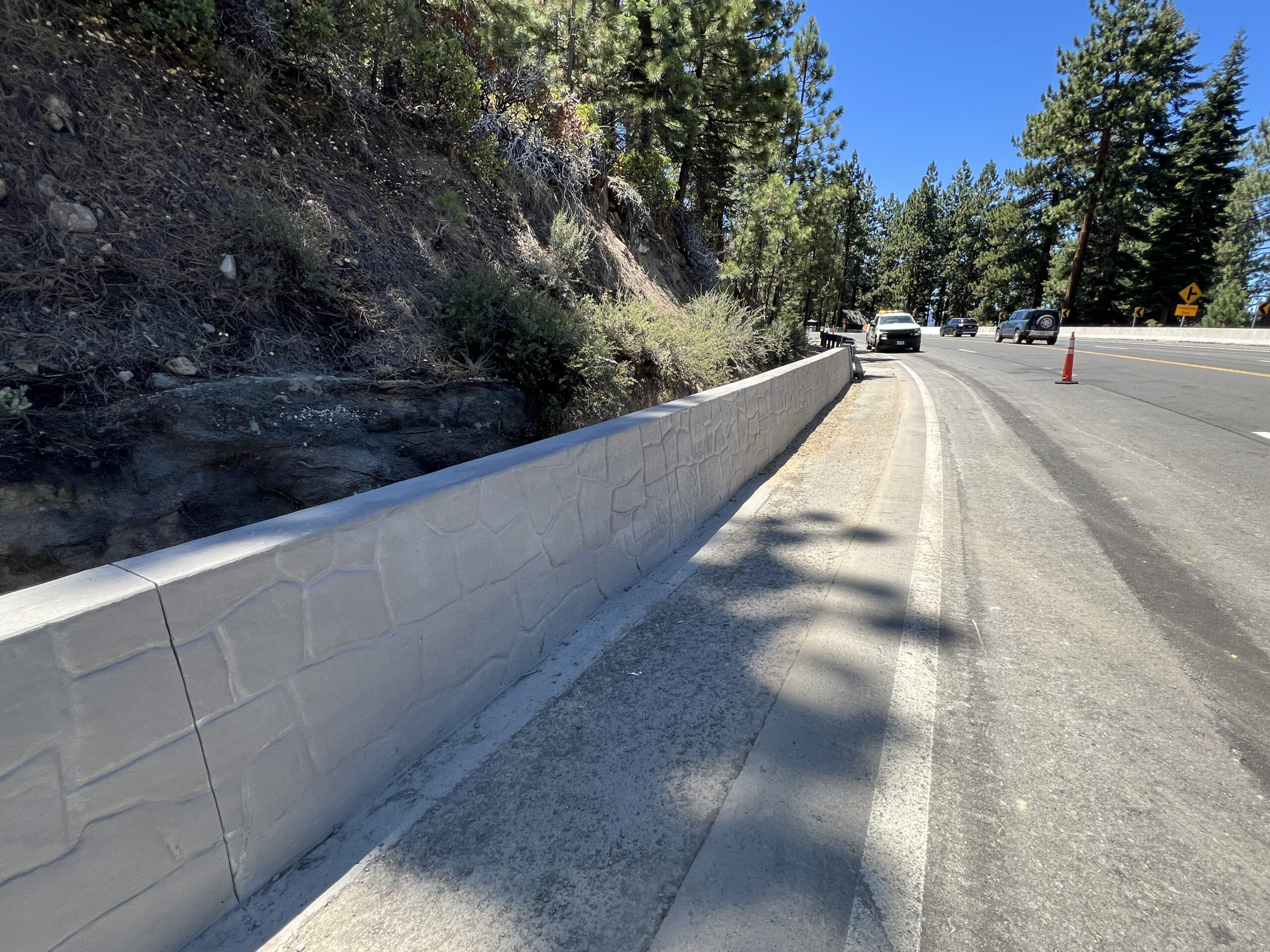 Certain sections of roadside guardrail will also be replaced or upgraded to concrete barrier to enhance safety. Existing asphalt curbs will be replaced with aesthetic concrete barrier rail to improve traffic safety.
