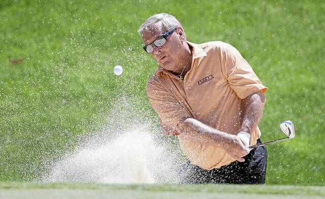 Fuzzy Zoeller hits out of a bunker to the ninth green during the first round of the PGA Tour Champions Principal Charity Classic on June 3, 2016, in Des Moines, Iowa.